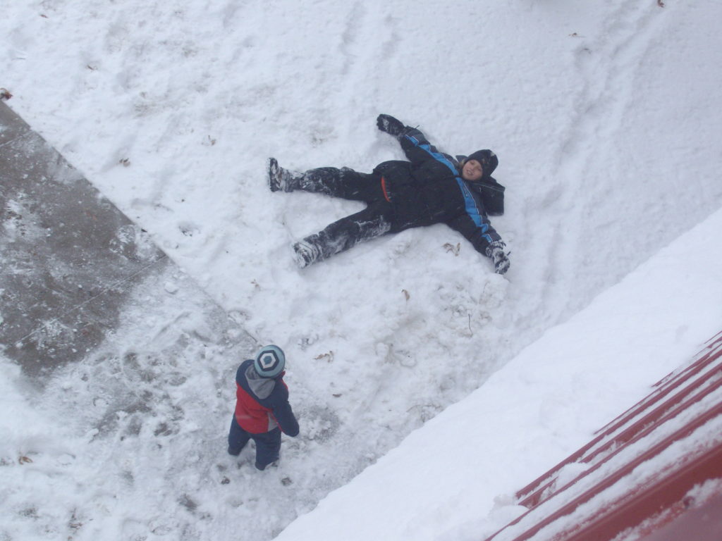 winter kids playing in the snow